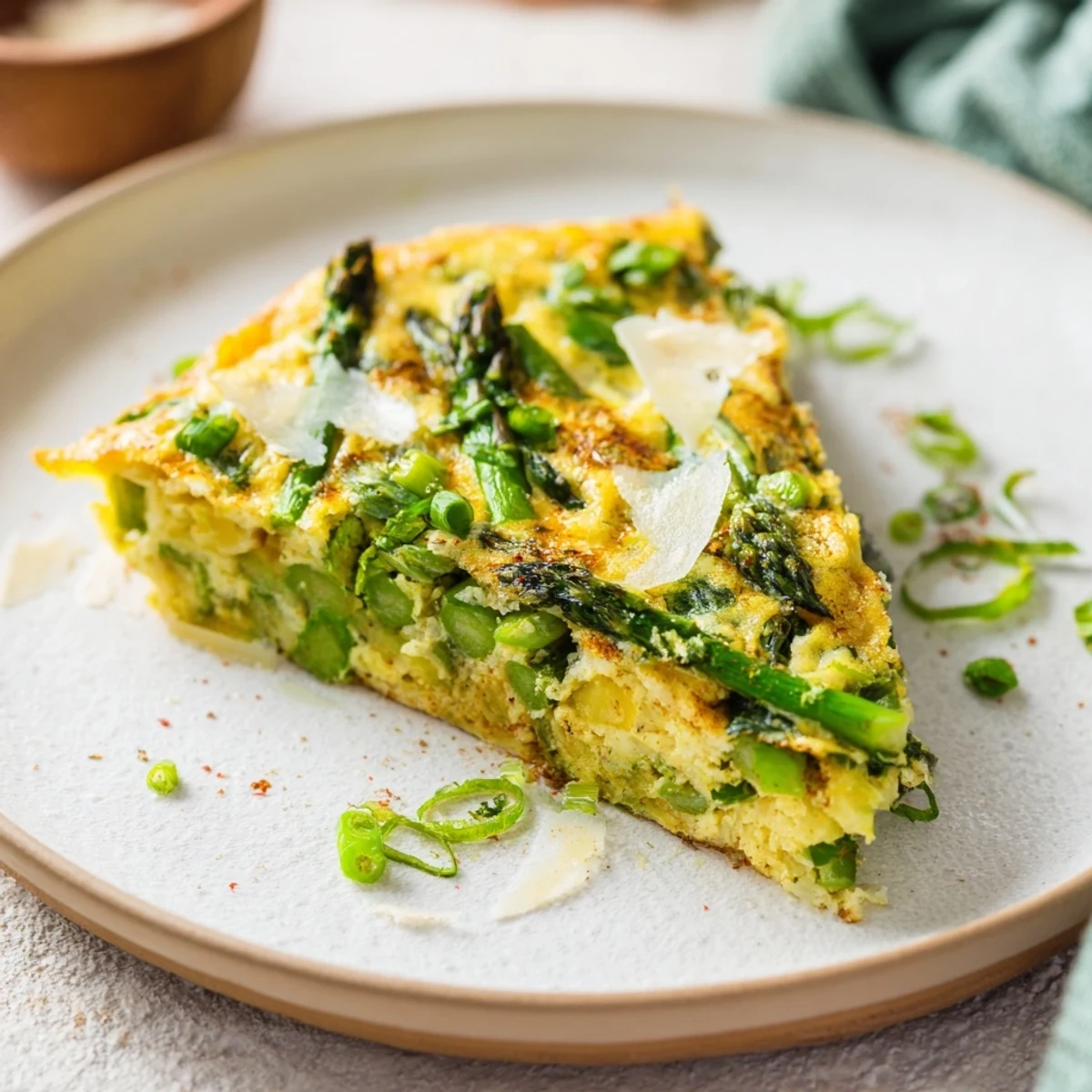 A beautifully browned Meadow-Soft Cozy Plate: Frittata, filled with spring greens and creamy goat cheese.