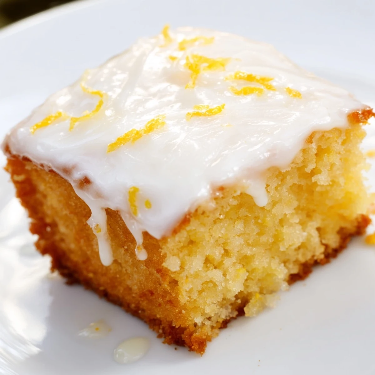 Homemade lemon loaf with a crackly, sweet icing, perfect for a cozy afternoon treat.
