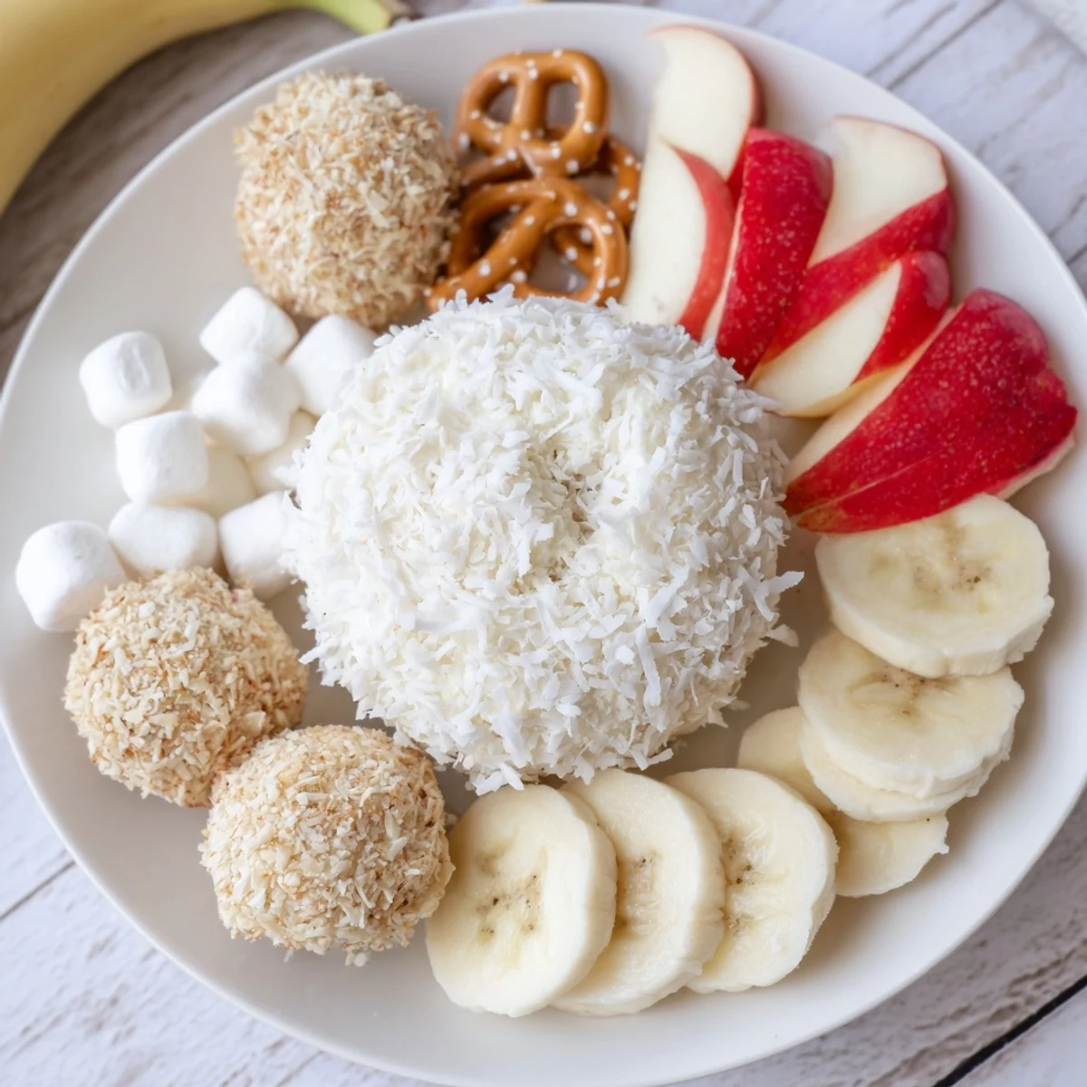 Creamy Marshmallow Snowball Dip Platter, a delightful dessert with snowballs and fresh fruit dippers.