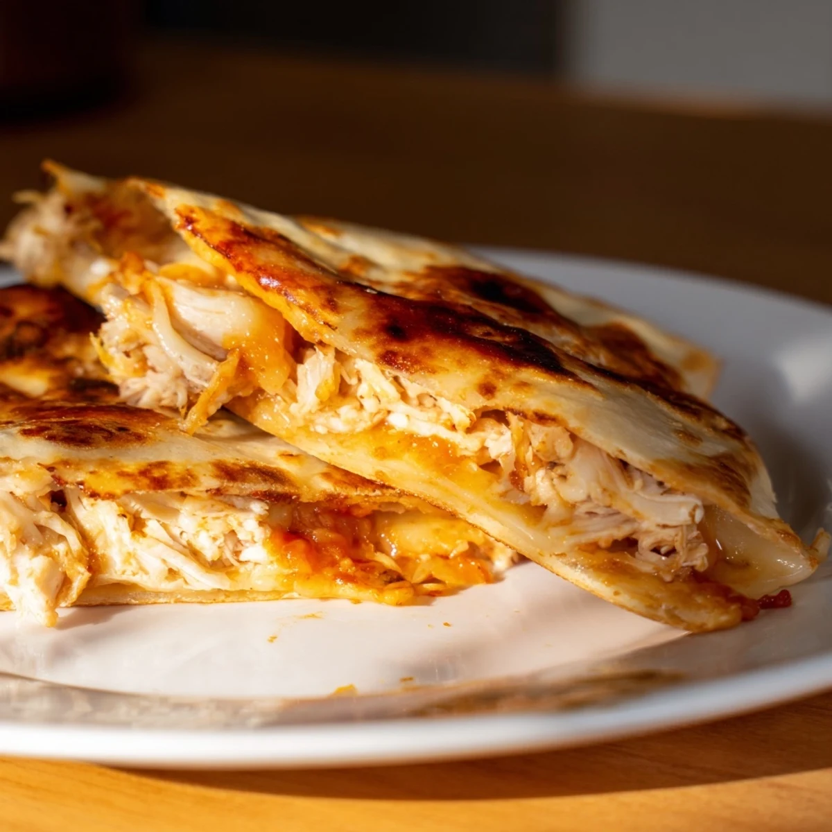 A steaming, halved Leftover Pizza Grilled Cheese: a delicious upgrade with pizza and shredded chicken.