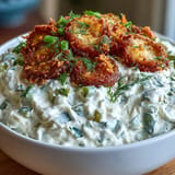 Tangy cream cheese and ranch dip, adorned with crunchy fried pickle slices.