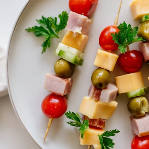 Savory Skewers showcasing vibrant cubes of meat, cheese, and pickle, ready for easy snacking.