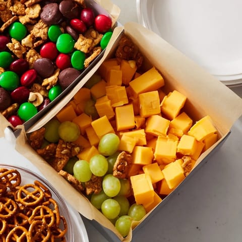 Festive Stacked Christmas Gift Snack Tower, a colorful holiday treat with savory and sweet layers.