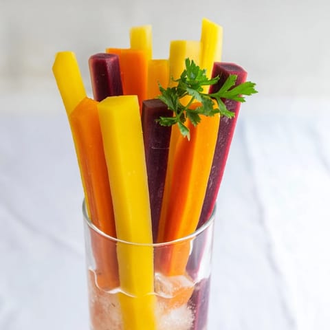A refreshing image of Simple Crudités: rainbow carrot sticks chilled, awaiting tasty dips.