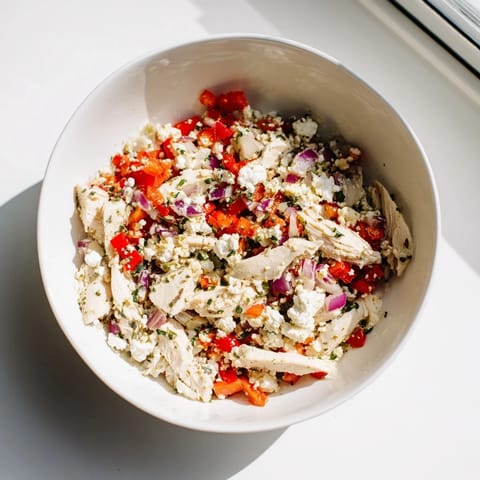 Close-up of a refreshing canned chicken salad, enhanced by Mrs. Dash, perfectly portioned for a quick lunch.