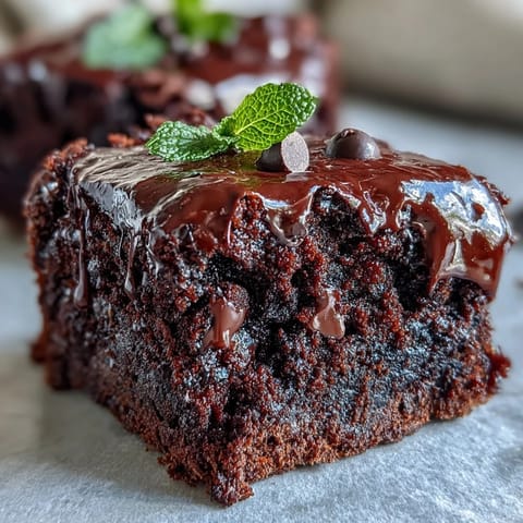 St. Patrick's Day mint chocolate chip brownie bites with festive green swirls and gooey chocolate chips, served on a party platter.