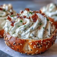 Creamy deviled eggs topped with everything bagel seasoning and fresh chives, a perfect appetizer for brunch or parties.