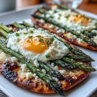 Crispy asparagus and egg flatbread with parmesan, baked to golden perfection for a delicious brunch.  