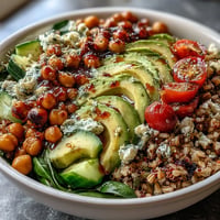 Hearty Ancient Grains Bowl with vibrant veggies and creamy tahini dressing.